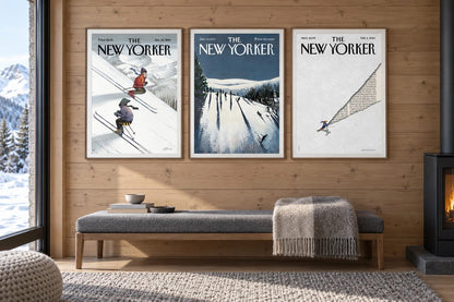 Three ski prints hang on a light wood wall above a long bench beside a window.
