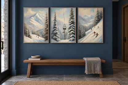Three snowy mountain prints hang on a blue wall above a long wood bench.