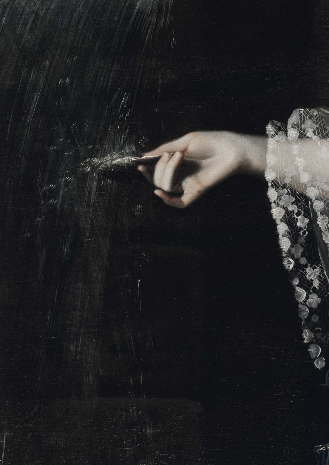 A hand with a small instrument appears beside paper.