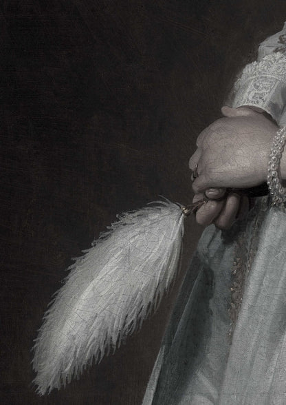 A hand holds a white feather fan.