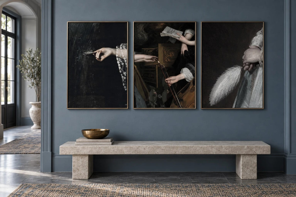Three detail prints hang above a light stone bench in a gray-blue entryway.