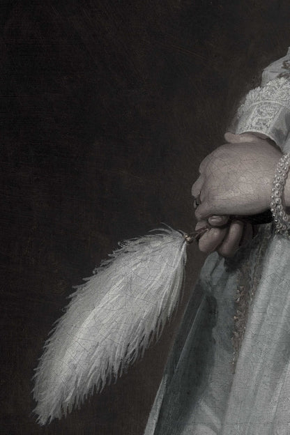 a hand holding a feather