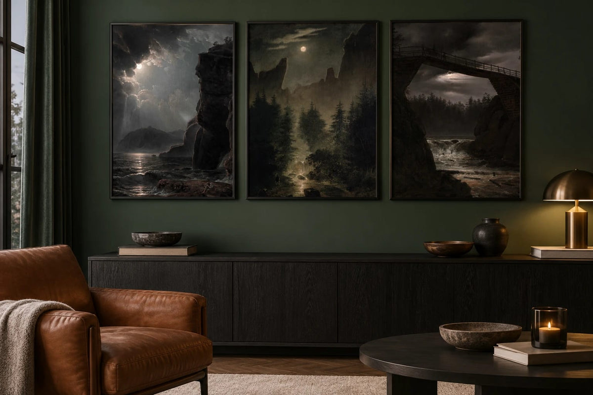 Three night landscapes hang on a deep green living-room wall.