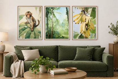 Three green prints above a deep green sofa.
