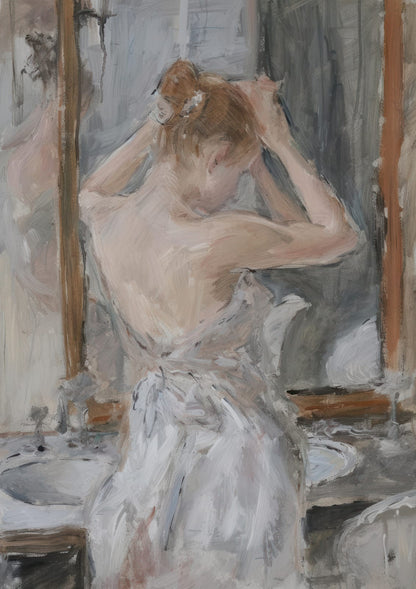 A woman at a mirror touching her hair.