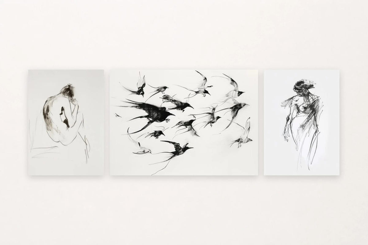 Three minimalist prints: a seated figure, birds in flight, and a standing figure.