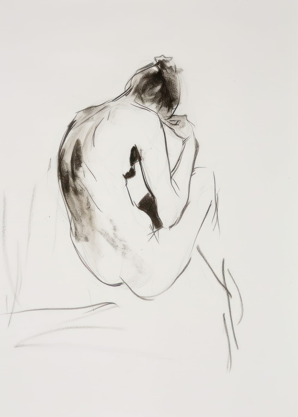 seated figure viewed from behind