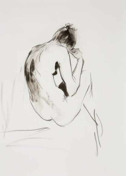 seated figure viewed from behind
