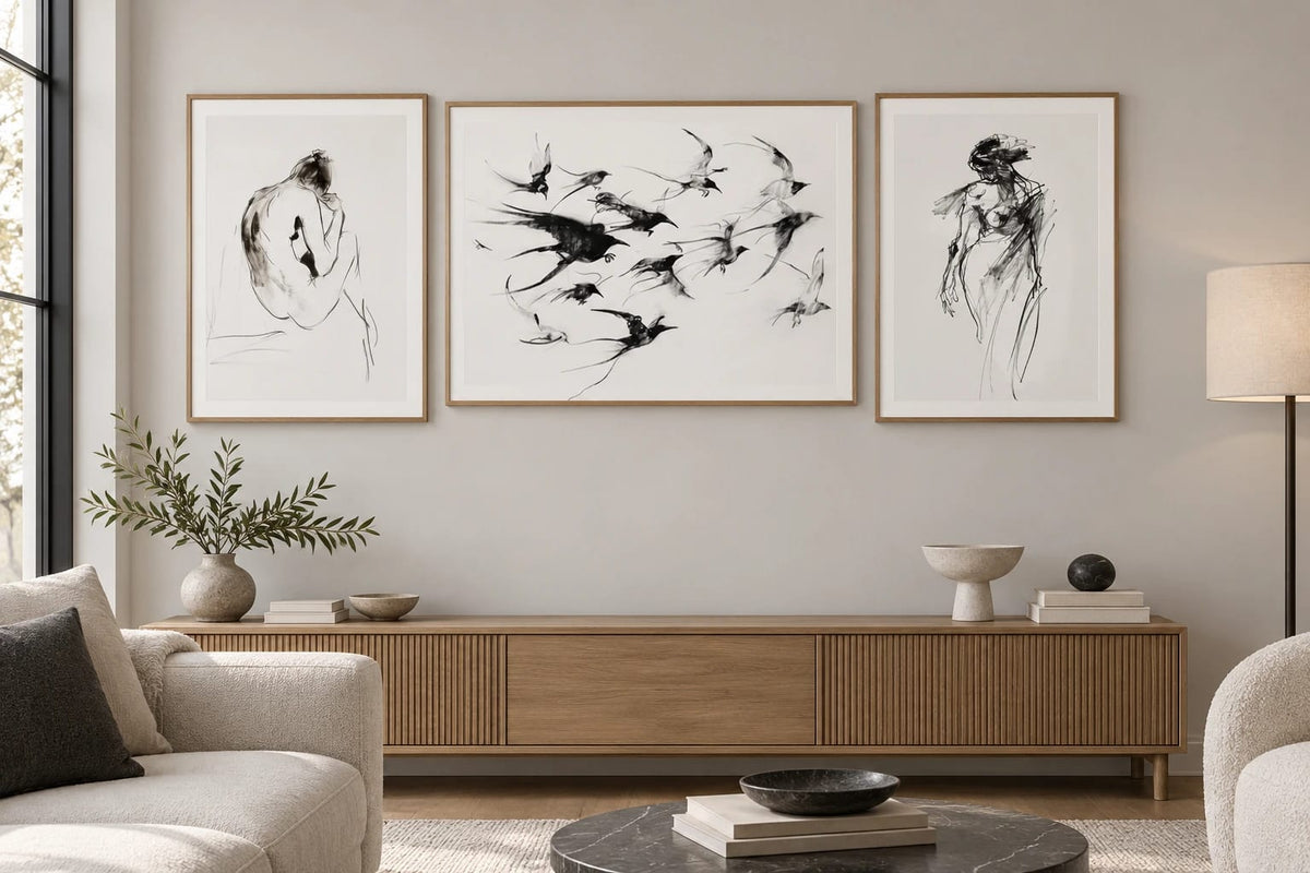 Figures and birds displayed above a console in a light living room.